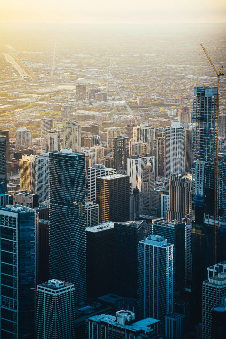 Breathtaking aerial shot of a bustling cityscape with towering skyscrapers at sunset